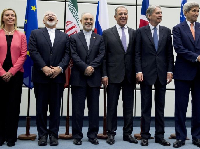 (From L to R) European Union High Representative for Foreign Affairs and Security Policy Federica Mogherini, Iranian Foreign Minister Mohammad Javad Zarif, Head of the Iranian Atomic Energy Organization Ali Akbar Salehi, Russian Foreign Minister Sergey Lavrov, British Foreign Secretary Philip Hammond and US Secretary of State John Kerry pose for a group picture at the United Nations building in Vienna, Austria July 14, 2015. Iran and six major world powers reached a nuclear deal, capping more than a decade of on-off negotiations with an agreement that could potentially transform the Middle East, and which Israel called an 'historic surrender'. AFP PHOTO / POOL / JOE KLAMAR