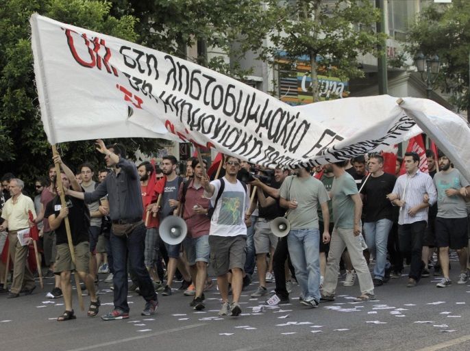 Supporters of the Greek far-left and anti-EU 'ANT.AR.SY.A.' party, hold banners as they march towards to Syntagma square in Athens, Greece, 02 July 2015, to support a 'No' voting in the referendum to be held on 05 July when Greek voters will be asked whether the country should accept reform proposals made by its creditors. Greek Prime Minister Alexis Tsipras is telling people to reject the measures, arguing that a 'No' would give him a mandate for new bailout negotiations. It would be 'extremely difficult' to keep Greece in the eurozone if the country votes 'No' in this weekend's referendum, Jeroen Dijsselbloem, the head of the Eurogroup of eurozone finance ministers, said. EPA/ORESTIS PANAGIOTOU