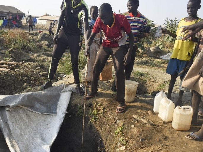 In this photo taken Tuesday, Jan. 19, 2016, displaced people draw water from a hole dug in the ground, in the United Nations camp for displaced people in the capital Juba, South Sudan. When a delegation of South Sudanese rebels returned to the government-controlled capital Juba last month after two years of war, many refugees thought they would finally return to the homes they fled. But prospects for peace seem dim after the government and rebels missed a deadline last week to form a power-sharing government and end the war. Photo/Jason Patinkin)