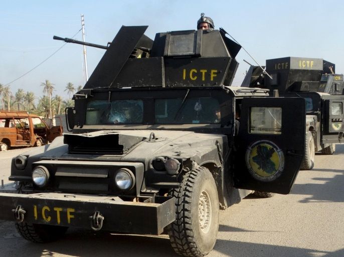 Military vehicles of the Iraqi security forces are seen in the city of Ramadi, February 3, 2016. Picture taken February 3, 2016. REUTERS/Stringer FOR EDITORIAL USE ONLY. NO RESALES. NO ARCHIVE.