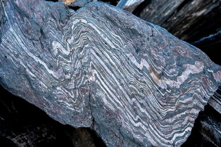An example of the 3.7 billion year old banded iron formation that is found in the northeastern part of the Isua Supracrustal Belt. Credit: Claire Nichols.